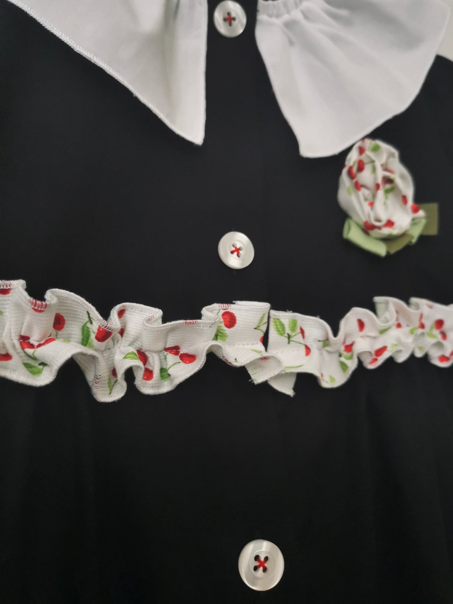 The black apron with cherries and pierrot collar for primary school